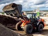 New Hitachi lifting dirt up